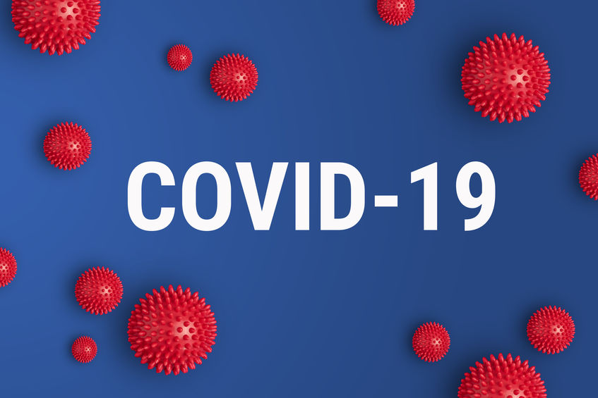 Inscription COVID-19 on blue background with red strain model of coronavirus Inscription COVID-19 on blue background. World Health Organization WHO introduced new official name for Coronavirus disease named COVID-19